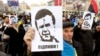 Protesters hold portraits of Ukrainian President Viktor Yanukovych during a demonstration in support of EU integration on Independence Square in Kyiv on November 29.
