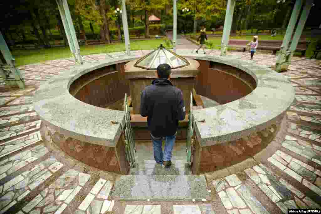 A fountain provides mineral water from Borjomi's artesian springs, believed to have many health benefits.