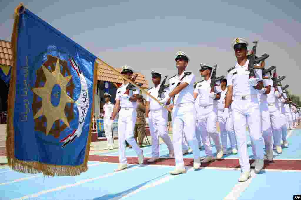 Iraqi naval officers march during their graduation ceremony in the mainly Shi&#39;ite southern city of Basra. The officers will be in charge of safeguarding Iraqi international waters and the floating oil platform in Al Faw. (AFP/Haidar Mohammed Ali) 