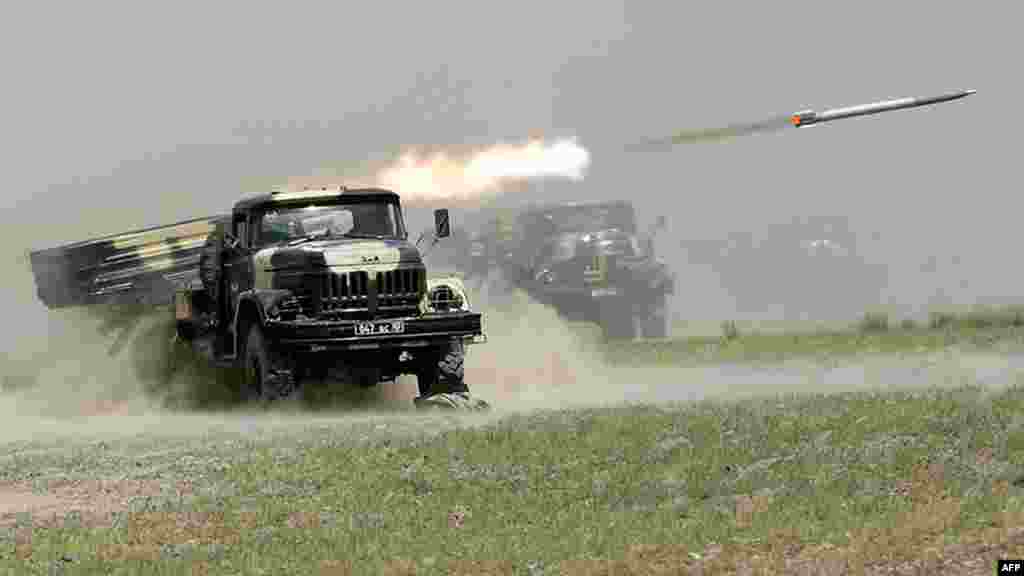 A Russian-built, multiple-launch rocket system fires during the Peace Mission 2012 joint counterterrorism military exercises of the Shanghai Cooperation Organization in Tajikistan. (AFP)
