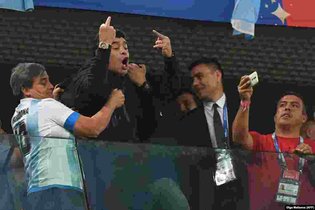 Retired Argentinian player Diego Maradona makes an obscene gesture to rival fans during his country&#39;s World Cup group match against Nigeria in St. Petersburg on June 26. (AFP/Olga Maltseva)