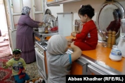 Iman Mohammed at home with her daughters Shahad, Shams, and Batoul