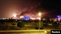 Smoke is seen following a fire at an Aramco factory in Abqaiq, Saudi Arabia, September 14, 2019 in this picture obtained from social media.