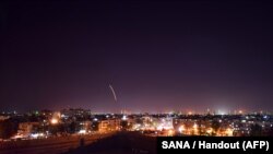 A handout picture released by the official Syrian Arab News Agency (SANA) on September 15, 2018, reportedly shows Syrian air defense batteries responding to what the Syrian state media said were Israeli missiles targeting Damascus international airport.