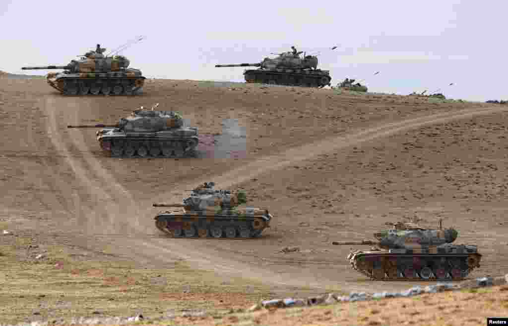 Turkish Army tanks take up position on the Turkish-Syrian border near the southeastern town of Suruc, in Sanliurfa Province. (Reuters/Murad Sezer) 