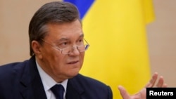 Ousted Ukrainian President Viktor Yanukovych takes part in a news conference in the southern Russian city of Rostov-na-Donu in late February 2014.