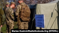 Ukrainian soldiers vote in a special ballot station in the village of Krymske in the Luhansk region on April 21.