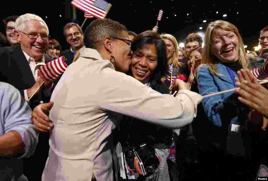 Keesha Patterson (left) of Ft. Washington, Maryland, proposes marriage to her girlfriend Rowan Ha during an election-night rally at Obama&#39;s campaign headquarters in Chicago. Obama has expressed support for the legalization of same-sex marriage.