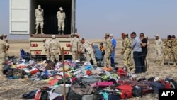 Russian emergency services personnel and Egyptian servicemen work at the crash site of a A321 Russian airliner in Wadi al-Zolomat, a mountainous area of Sinai, on November 2.