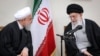 File - Iranian supreme leader Ayatollah Ali Khamenei (R) speaks with President Hassan Rouhani during a meeting with members of Iranian Assembly of Experts in Tehran, March 14, 2019
