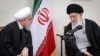 Iranian supreme leader Ayatollah Ali Khamenei (R) speaks with President Hassan Rohani during a meeting with members of Iranian Assembly of Experts in Tehran, March 14, 2019