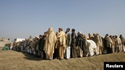 A funeral prayer is held in Swabi for Lubna Mahmood, 26, one of the aid workers who was killed by unidentified gunmen.