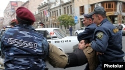 Armenia - Riot police detain a protester in Yerevan, 2Dec2013.
