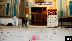 A baby's milk bottle lays at the entrance to the shrine of Sufi Muslim Saint Lal Shahbaz Qalander after a suicide bomb attack in Sehwan on February 17.