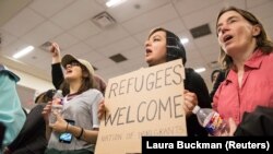 Protesters against the new policy at the international airport in Dallas, Texas, on January 29.