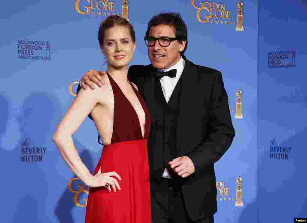 Redatelj David O. Russell i glumica Amy Adams. Film "Američka prevara" nagrađen je u kategoriji mjuzikla/komedij, Beverly Hills, California, 12. januar 2014. Foto: REUTERS / Lucy Nicholson