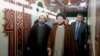 A picture taken in 2010 shows Lebanese Shiite cleric Muhammad Kawtharani (L), who has long spearheaded Hezbollah's Iraq policy, alongside Iraqi Shiite Muslim leader and head of Hikma party Ammar al-Hakim (C) during a visit to the gravesite of assassinated