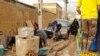 People trying to dig out of a thick layer of mud left by days of floods in Lorestan province. APRIL 4, 2019