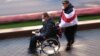 People take part in the &quot;March of People With Infinite Possibilities,&quot; an opposition event/rally held by disabled people, in Independence Square, Minsk, October 22, 2020.