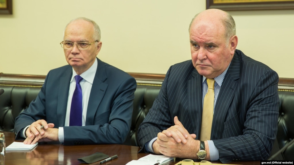 Russian Deputy Foreign Minister Grigory Karasin (right) has vowed a "tough" response.