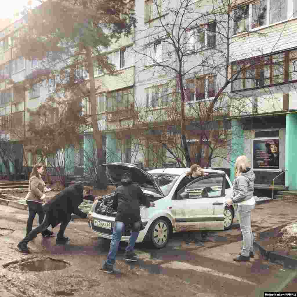 And friends heaving a broken-down car into a parking spot. 