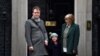 Richard Ratcliffe, husband of British-Iranian aid worker Nazanin Zaghari-Ratcliffe jailed in Tehran since 2016, his daughter Gabriella and his mother Barbara, pose outside of at 10 Downing Street in central London on January 23, 2020, to meet with Britain's Prime Minister. AFP