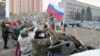 Ukraine -- Pro-Russian activists reinforce their barricade outside the regional security service building in the eastern city of Luhansk, April 10, 2014