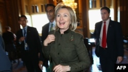 U.S. - U.S. Secretary of State Hillary Clinton smiles as she leaves the Vice President's office outside the U.S. Senate chamber following passage of the New START treaty, Washington, DC, 22Dec2010