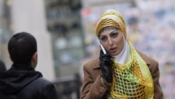 Azerbaijan -- A woman wearing the hijab, or Islamic headscarf, walks in Baku, 18Jan2011