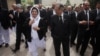 FILE: The Chief Justice of Pakistan Saqib Nisar speaks with Justice Mussarat Hilali while visiting the High Court in Peshawar, Pakistan.