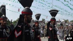 Pakistani Rangers march during a flag hoisting ceremony to celebrate Pakistan's Independence Day on the Pakistan-India border crossing Wagah on August 14.