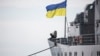 A Ukrainian Navy sailor stands guard on the "Slavutych" flagship in Sevastopol on March 18. The ship was seized by pro-Russian forces four days later. 