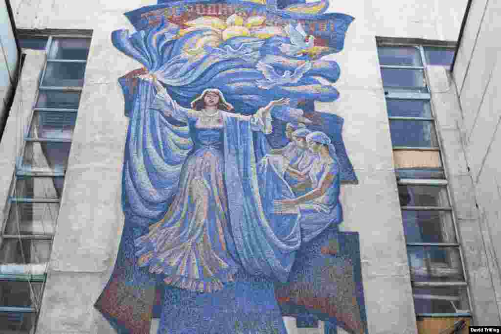 Above the entrance to a textile factory in Bishkek. At the top, it says, &quot;Our work, Motherland, is for you.&quot;