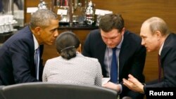 U.S. President Barack Obama (left) talks with Russian President Vladimir Putin (right) and U.S. national security adviser Susan Rice (2nd left) prior to the opening session of the G20 summit in the Mediterranean resort city of Antalya, Turkey, on November 15.