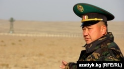 A Kyrgyz border guard stands watch in Batken Province on the country's frontier with Uzbekistan and Tajikistan.