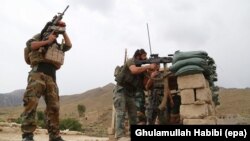 Afghan soldiers secure a check post in restive Achin district of Nangarhar Province, where Afghan and U.S. security forces are engaged in an operation against the Islamic State militants, on August 18.