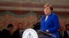 ITALY -- German Chancellor Angela Merkel speaks after she received a "Peace Lamp" award from the Catholic monks at the Basilica of St. Francis in Assisi, Italy, May 12, 2018.