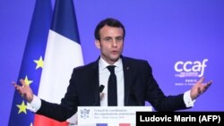 FRANCE -- French President Emmanuel Macron speaks during the annual dinner of the Co-ordination Council of Armenian organisations of France (CCAF), in Paris, February 5, 2019