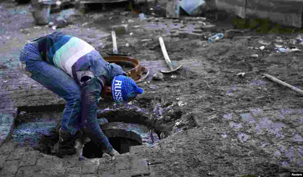 Work is under way on an underground pipe in the village of Esto Sadok, part of greater Sochi.