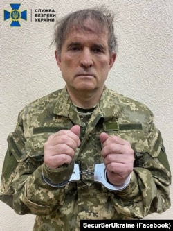 Medvedchuk in handcuffs.