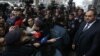 Armenia - Prosecutor-General Artur Davtian (R) addresses protesters outisde his office in Yerevan, December 24, 2018.