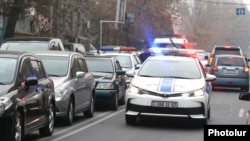 Armenia -- A police car races through heavy traffic in Yerevan, November 27, 2019.
