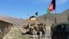 FILE: A Afghan army convoy on a major road in Kandahar Province.