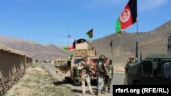 FILE: A Afghan army convoy on a major road in Kandahar Province.