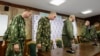 A group of Russian servicemen, who were detained by the Ukrainian authorities in southeastern Ukraine, arrive at a news conference in Kyiv on August 27.