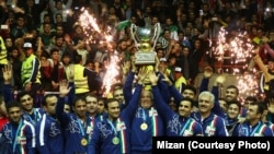 Iranian wrestlers celebrate winning the Freestyle World Cup on home soil on February 17.