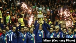 Iranian wrestlers celebrate winning the Freestyle World Cup on home soil on February 17. 