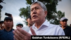 Ex-President Almazbek Atambaev speaks to the media outside his compound in Koi Tash on June 27, 2019.