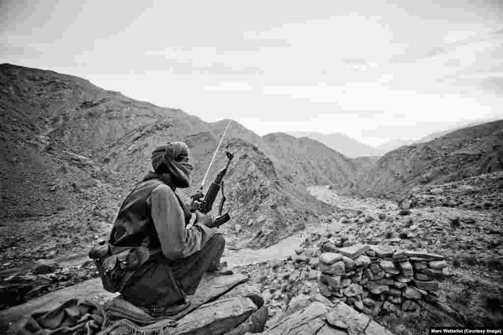 Not far from the strategic Bolan Pass, a member of the Baloch Liberation Army keeps watch.