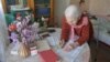 An elderly woman casts her vote from home in Moscow's municipal elections on September 10. 